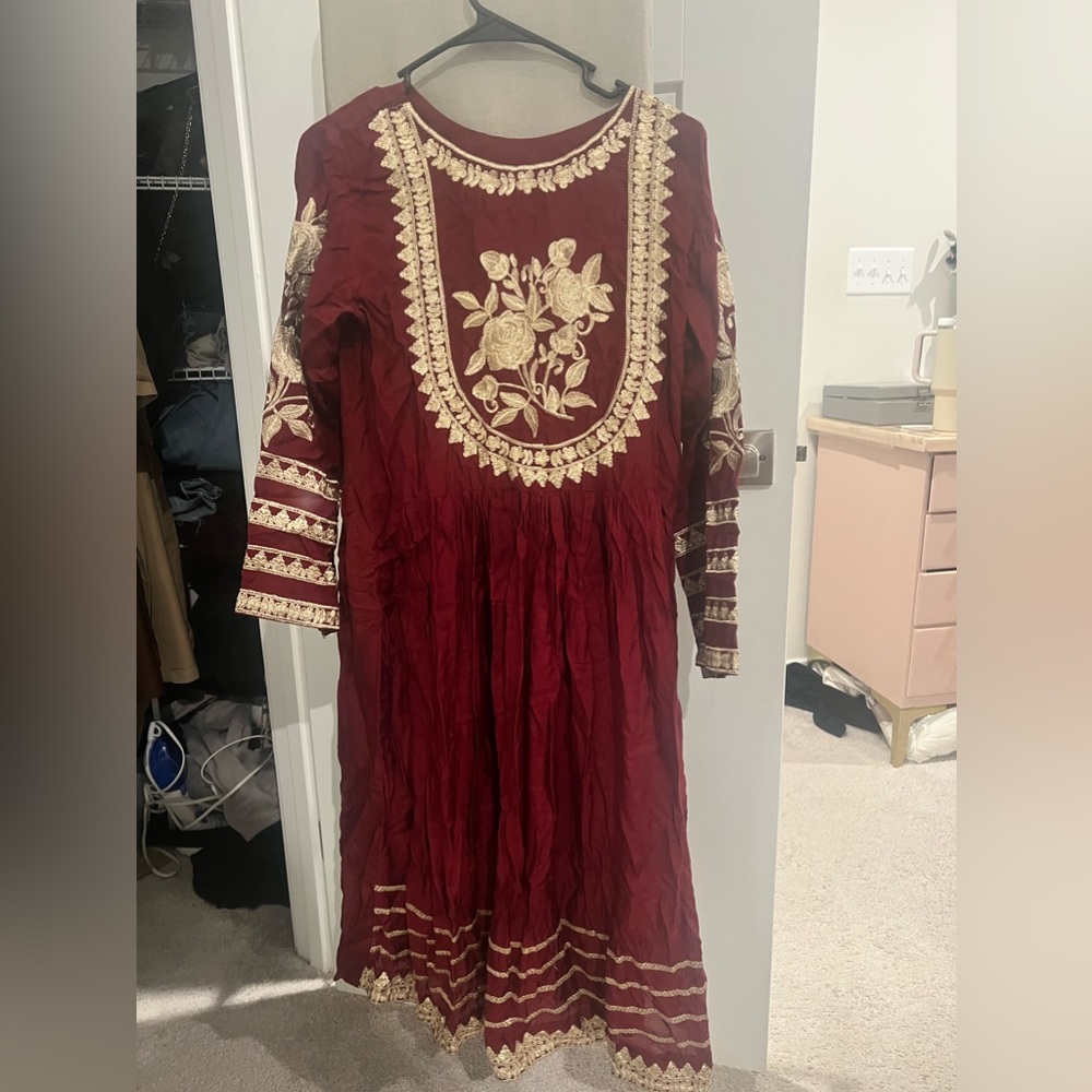 Burgundy frock with gold embellishment